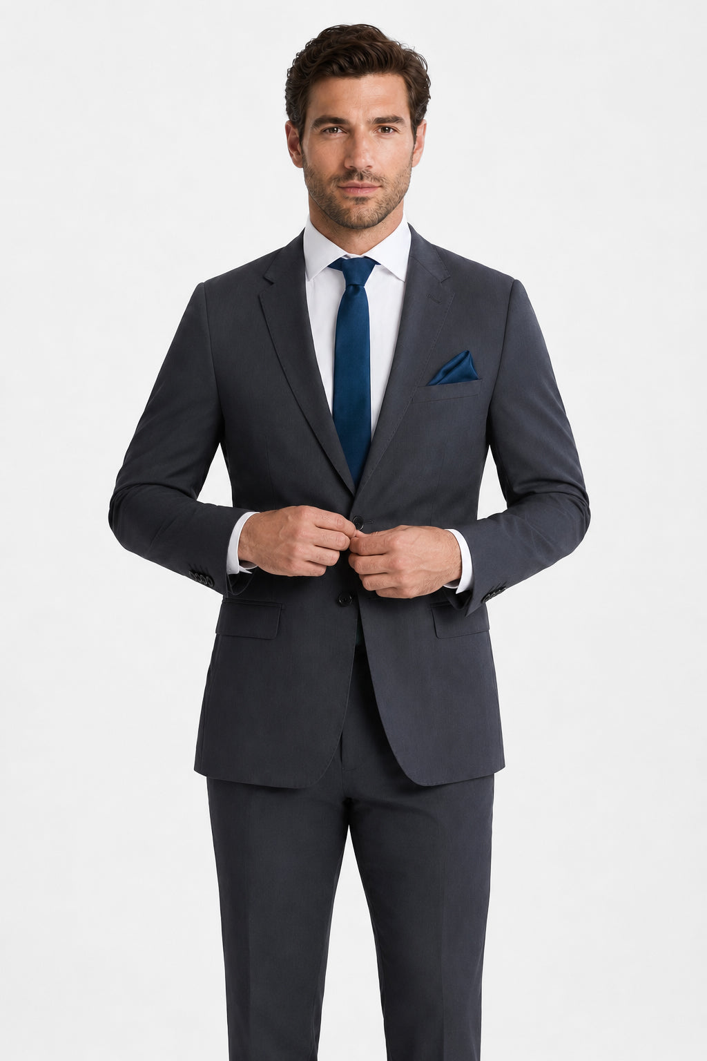 Man wearing a dark gray suit with a blue tie and pocket square on a white background